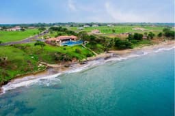 THE ULTIMATE IN OCEANFRONT BEACH HOME LIVING!!! NEAR CULTURAL TOWN OF